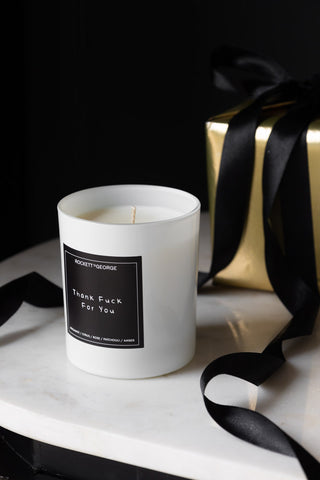 Lifestyle image of the Rockett St George White Thank Fuck For You Scented Candle with gift box