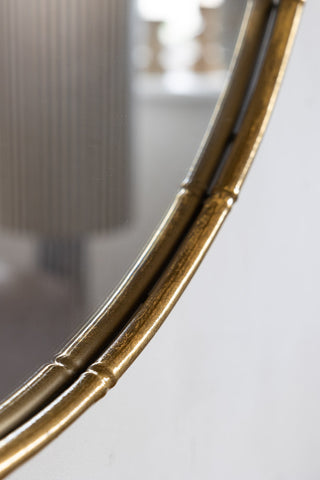 Close-up image of the Round Antique Gold Wall Mirror
