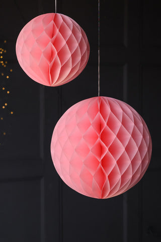 Lifestyle image of the Set Of 2 Baby Pink Honeycomb Ball Decorations