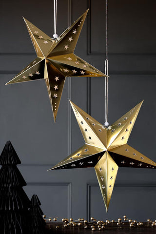 Lifestyle image for the Set Of 2 Gold Five-Pointed Paper Star Decoration