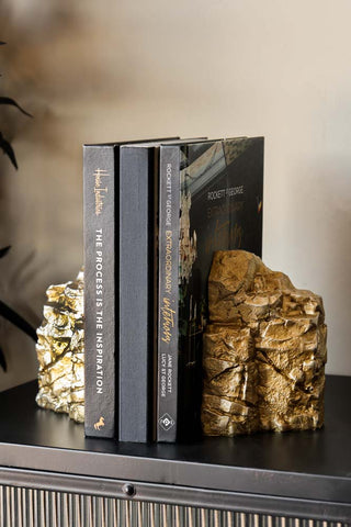 Lifestyle image of the Set Of 2 Gold Split Rock Bookends