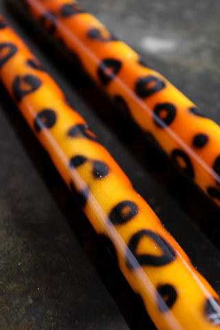 Close-up image of the Set Of 2 Leopard Print Candles
