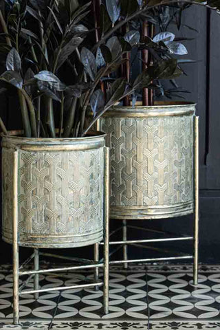 Lifestyle image of the Set Of 2 Antique Gold Patterned Planters