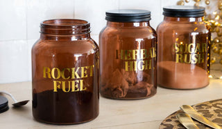 Image of the Set Of 3 Amber Glass Storage Jars With Black Lids - Herbal High