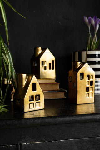 Lifestyle image of the Set Of 3 Gold House Tea Light Holders