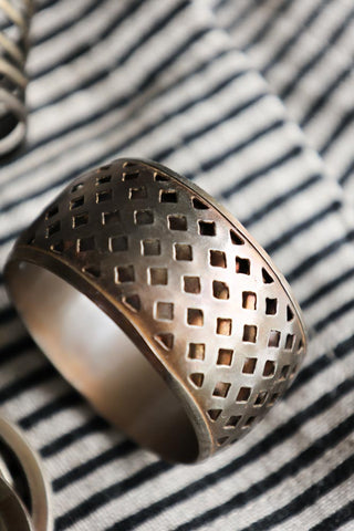 Close-up image of the diamond design from the Set Of 4 Individual Design Brass Napkin Rings