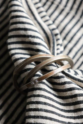 Image of the trio loop design from the Set Of 4 Individual Design Brass Napkin Rings