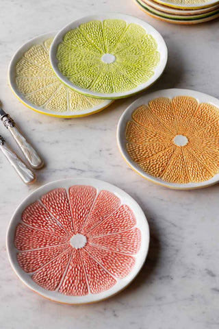 Lifestyle image of all 4 of the Set Of 4 Grapefruit Plates