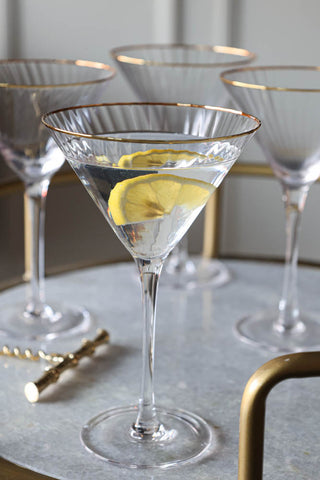 Close-up lifestyle image of the Set Of 4 Ribbed Martini Glasses With Gold Rim