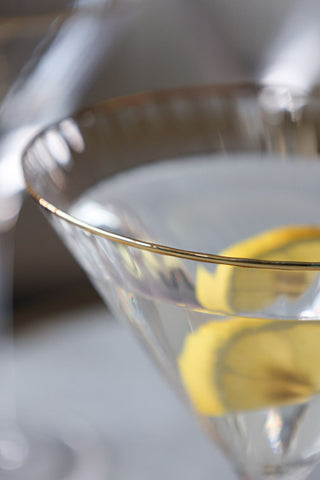 Lifestyle image of the gold rim on the Set Of 4 Ribbed Martini Glasses