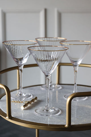 Image of the Set Of 4 Ribbed Martini Glasses With Gold Rim on a drinks trolley
