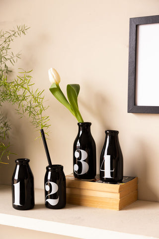 Landscape image featuring the Set Of 4 Vintage Style Numbered Black Bottles