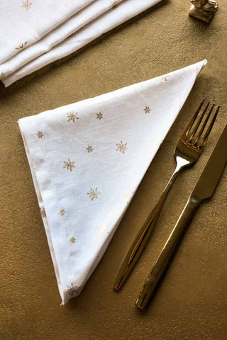Lifestyle image of the Set Of 4 White Napkins With Gold Stars