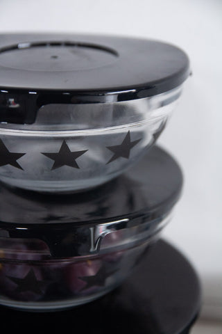 Close-up image of the lids with the smaller Set Of 5 Star Print Glass Bowls With Lids 