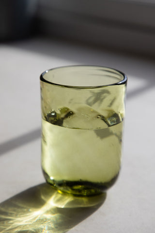 Lifestyle image of the Green Twist Water Glass