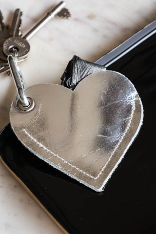 Lifestyle image of the Silver Heart Dog Poo Bag Pouch