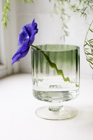 Lifestyle image of the Small Green Hurricane Candle Holder