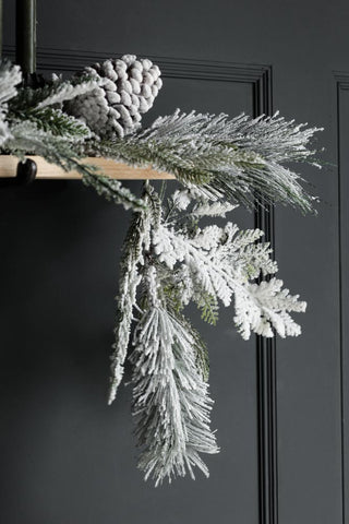 Close-up image of the end of the Snowy Pixed Pine Garland Decoration