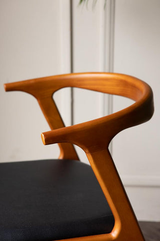 Detail image of the Solid Wood Mid-Century Black Faux Leather Dining Chair