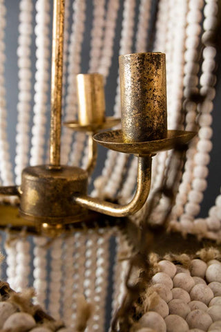 Close-up image of the detailing on the bulb holders of the Star Shaped Beaded Statement Chandelier Light