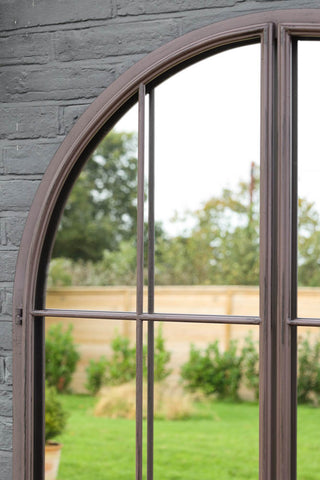 Image of the frame on the Tall Black Arch Indoor/Outdoor Window Pane Mirror With Opening Doors