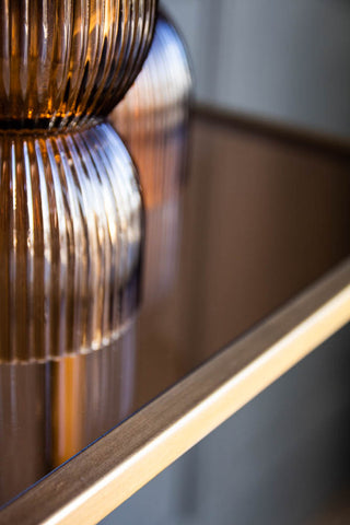 Close-up image of one of the shelves on the Tall Gold & Glass Art Deco Shelving Unit