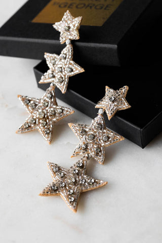 Lifestyle image of the Trio Silver Beaded Star Earrings