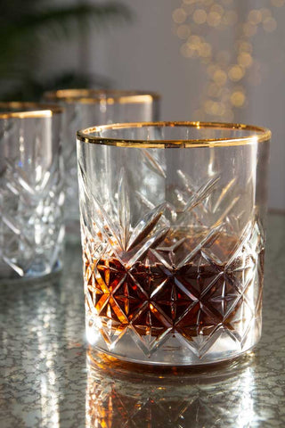Lifestyle image of the Vintage Cut Glass Tumbler With Gold Rim