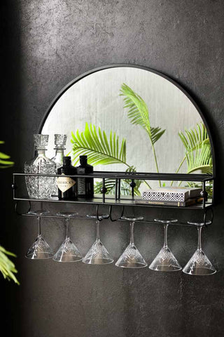 Lifestyle image of the Wall-Mounted Black Metal Bar Shelf With Mirror