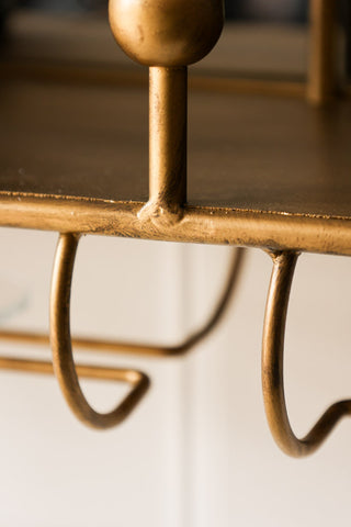 Image of the drinks holder for the Gold Wall Mirror With Bar Shelf