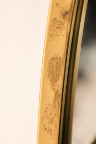 Close-up image of the Gold Wall Mirror With Bar Shelf