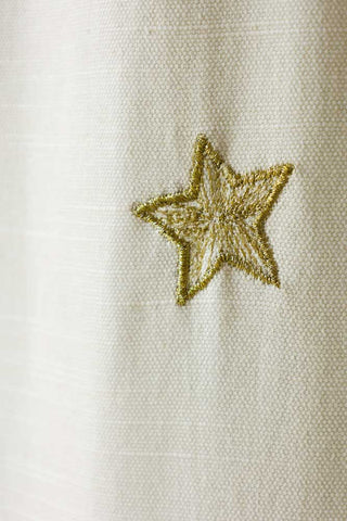 Close-up image of the Set of 2 Cream Curtains with Gold Embroidered Stars