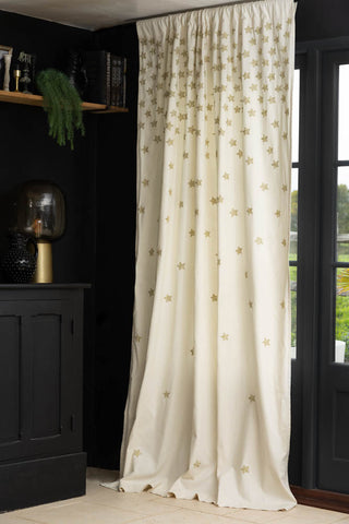 Lifestyle image of the Set of 2 Cream Curtains with Gold Embroidered Stars