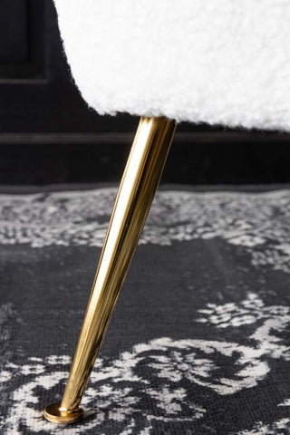 Close-up image of the legs on the White Teddy Armchair With Gold Legs