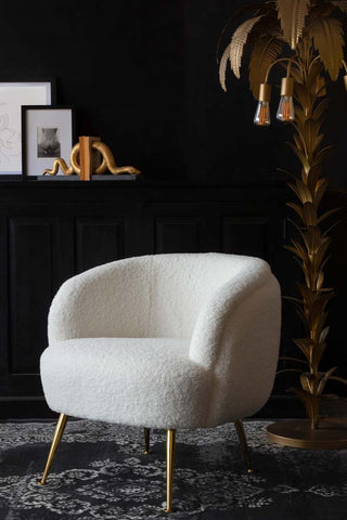 Lifestyle image of the White Teddy Armchair With Gold Legs