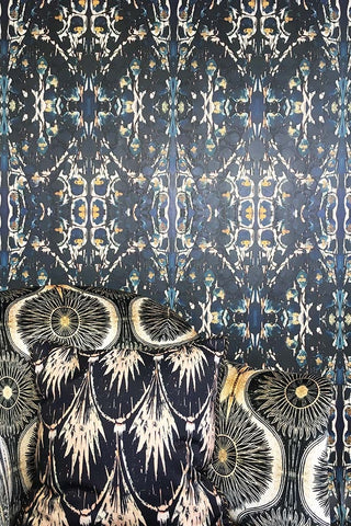 Close up image of Anna Haymans Sioxsie wallpaper in blues, blacks and gold pattern. 