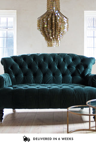 Lifestyle image of the Two-Seater Forest Green Velvet Sofa