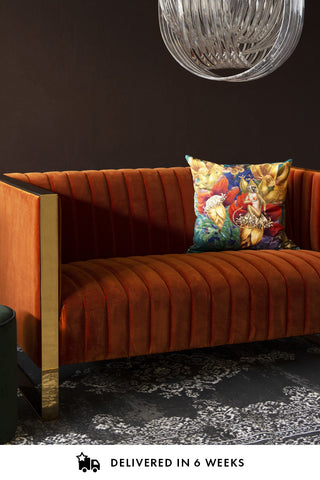 Lifestyle image of the Retro 50's Style Burnt Orange Velvet 2 Seater Sofa With Gold Trim