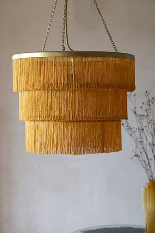 Close-up lifestyle image of the Gold Three-Tier Fringe Chandelier