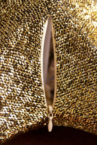 Close-up image of the zip open on the Gold Glitter Star