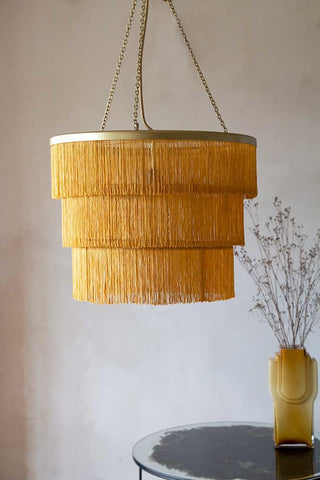Lifestyle image of the Gold Three-Tier Fringe Chandelier