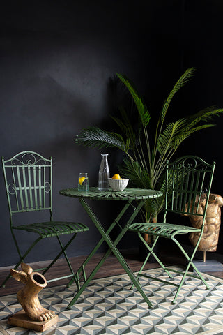 Lifestyle image of the Green Metal Garden Table & Chair Set