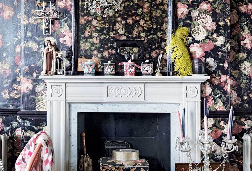 floral wallpaper and mantelpiece