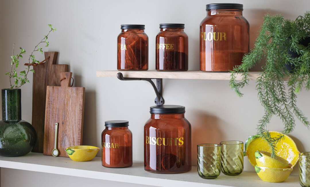 image of glass storage jars styled on shelves for simple kitchen updates