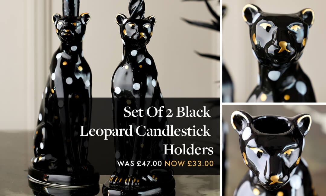 images of black leopard candlestick holders with gold and white spots