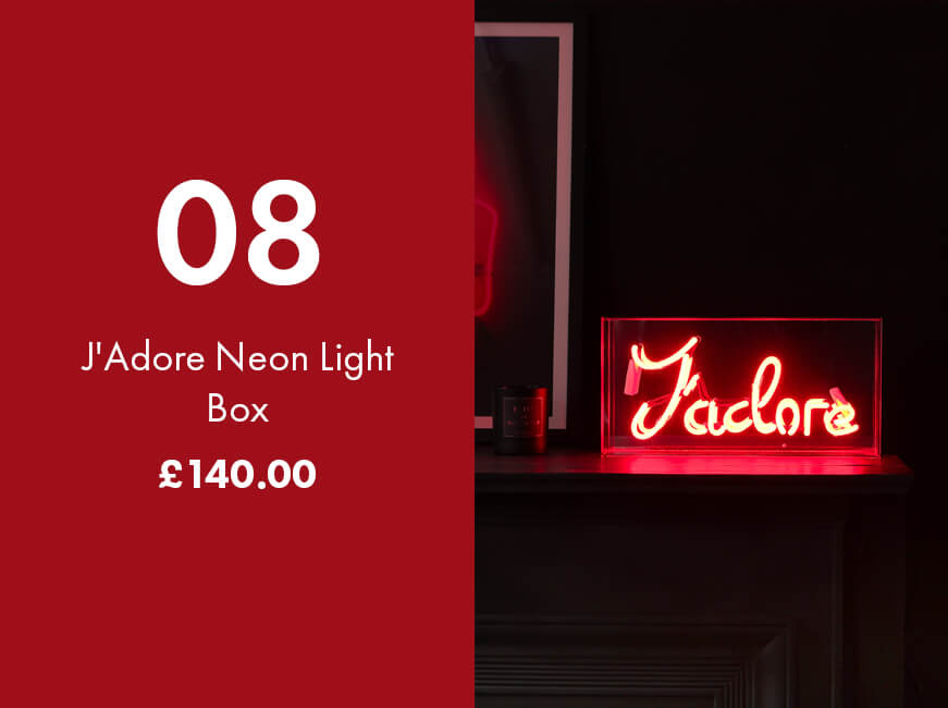 image of neon light box with the word J'adore written in neon red